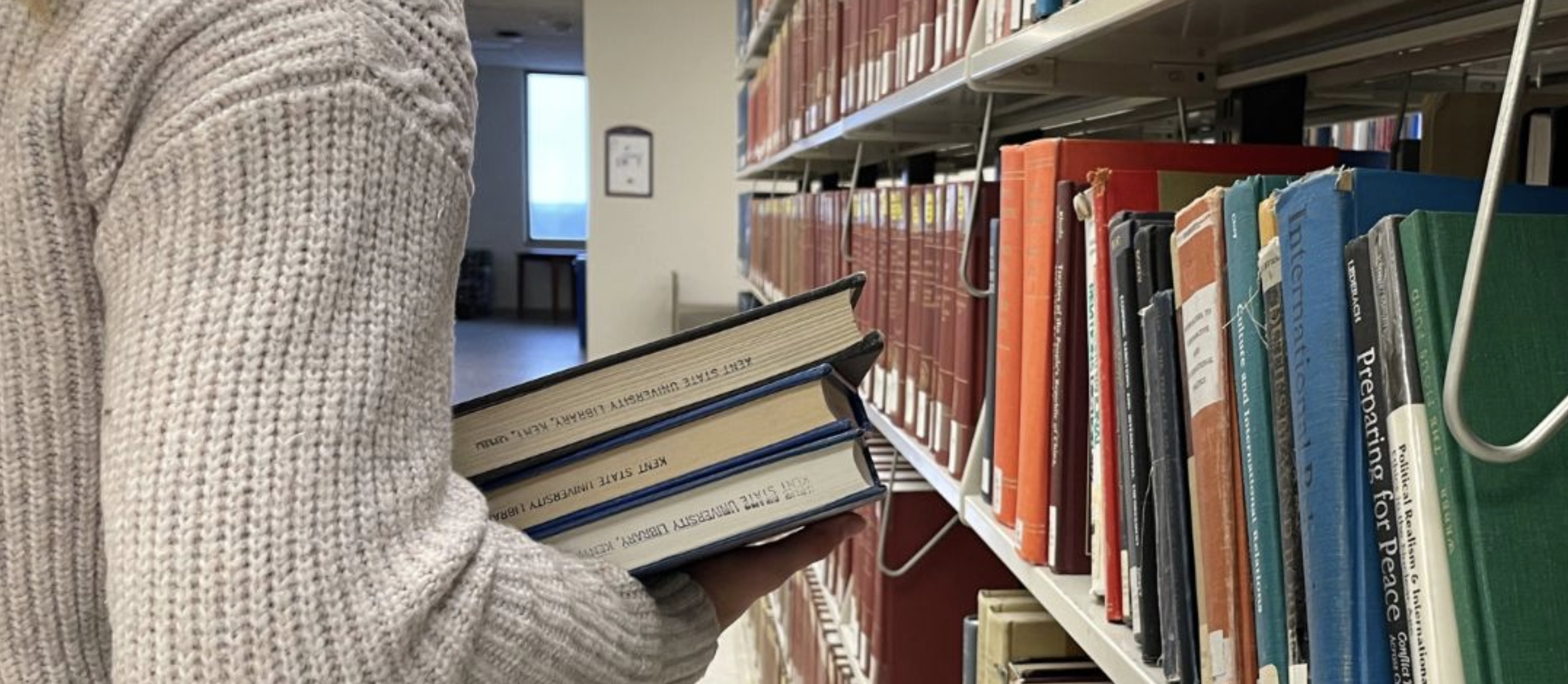 Student carrying books for research